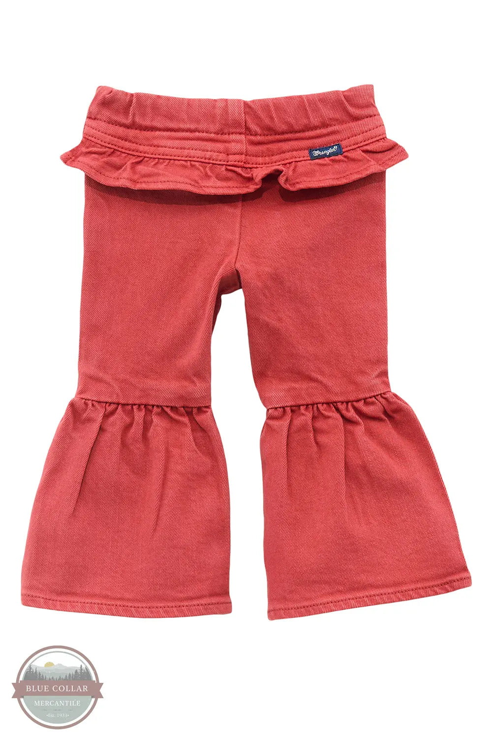 Red ruffled pants on a white background There’s no denying how cute your cowgirl will look in our Little Girl’s Vibrant Ruffle Leg Flare Jean. These flares are crafted from a soft cotton blend with a hint of stretch for extra comfort. They feature an elastic waist for easy changing, ruffles along the back for extra flair, and ruffled legs that will have her ready for the rodeo.
 Fit: Regular
 Waist: Elastic
 Leg: Flare back