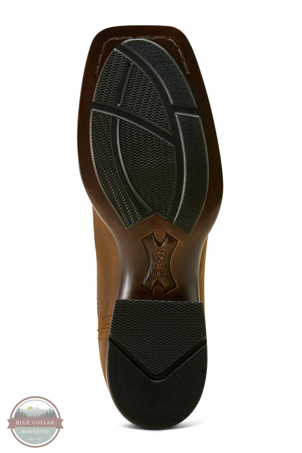 Close-up of a brown shoe sole with black tread pattern on a white Ariat 10063973 Booker Chelsea Wide Square Toe Western Bootbackground