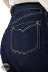 Close-up of dark blue jeans with a brand logo in the corner. Ariat 10065877 Ultra High Rise Veronica Wide Leg Jean