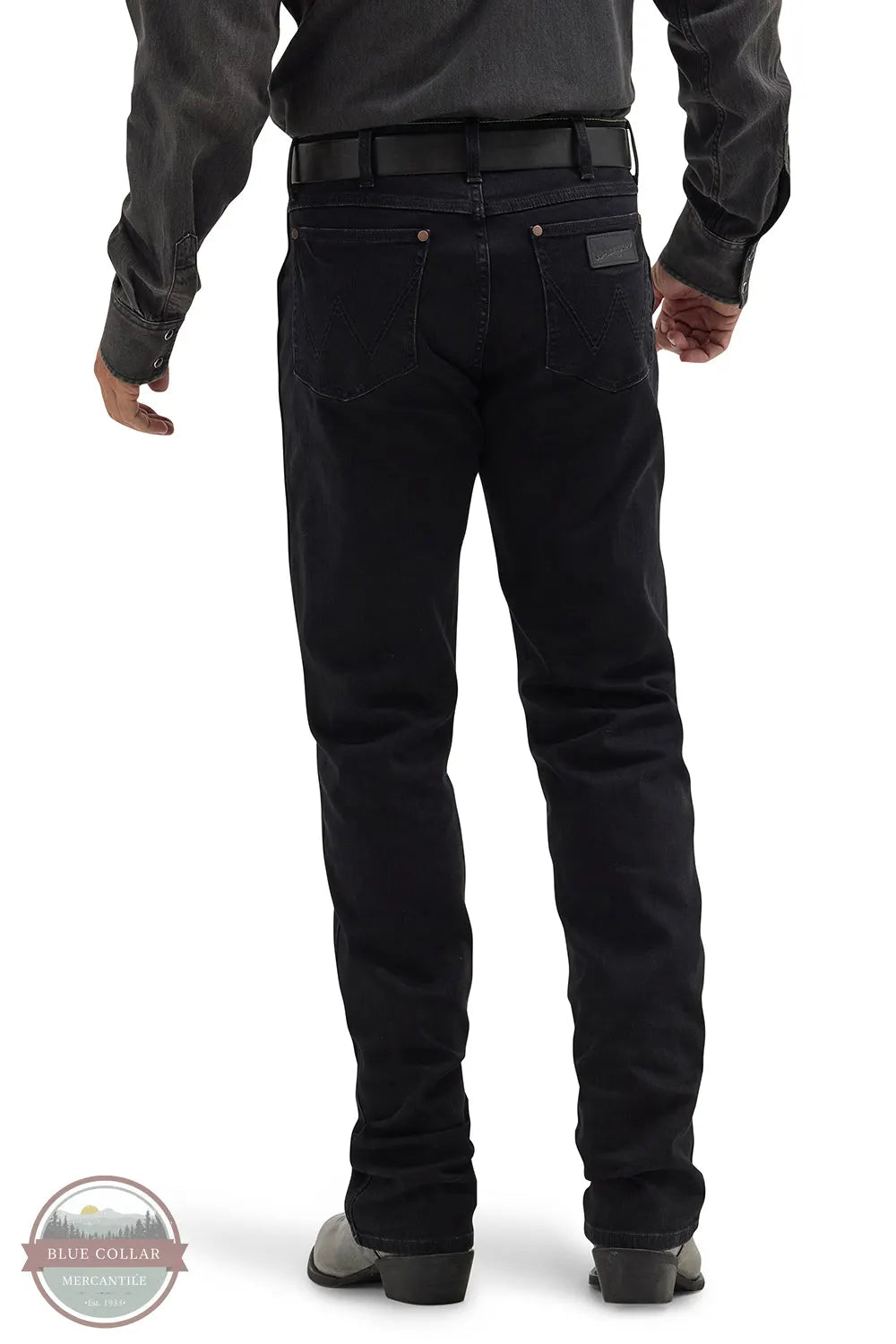 Person wearing black pants on a white background with Blue Collar logo. Wrangler 112358240 Retro Slim Fit Straight Leg Jean rear view