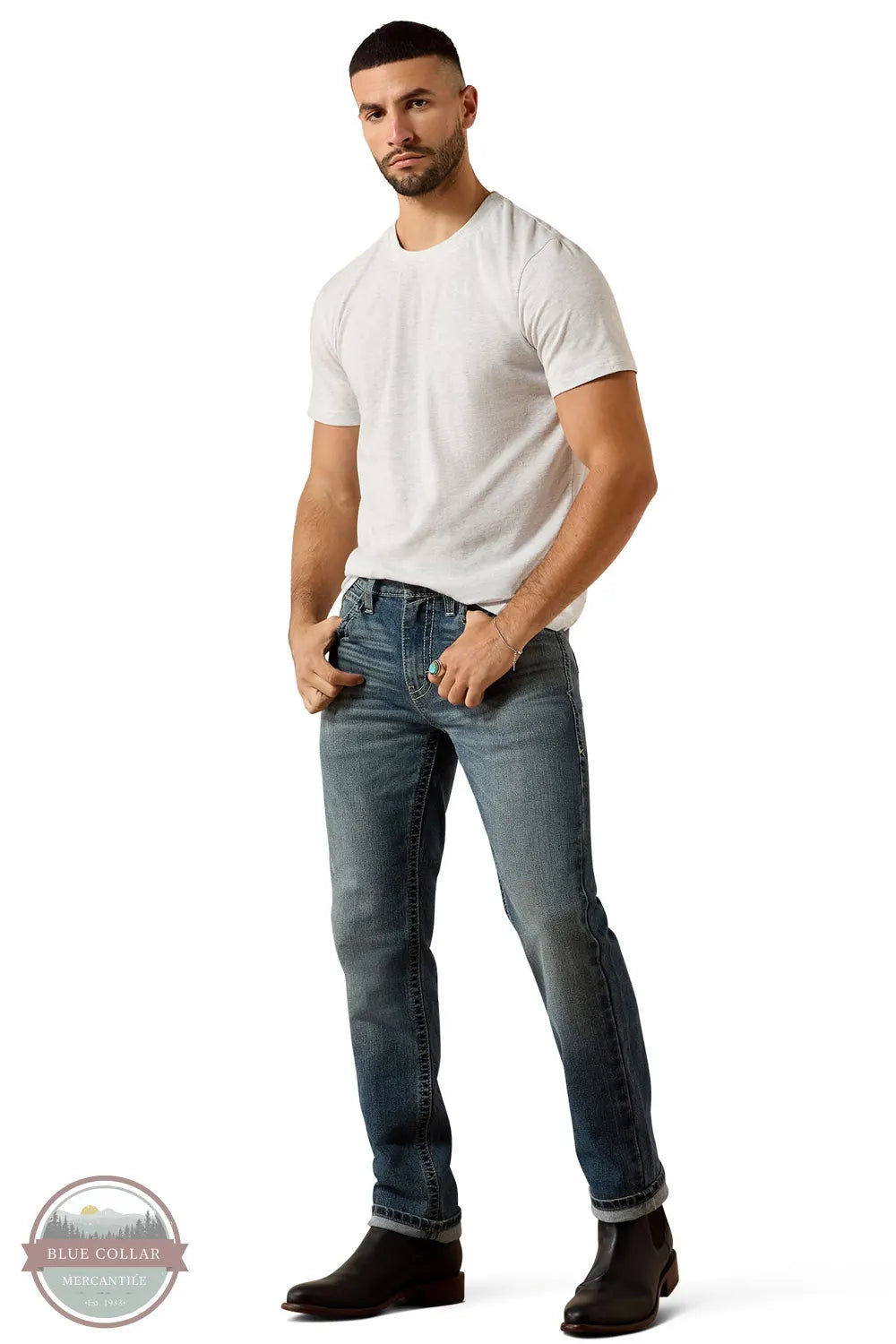 Ariat 10078954 Men's Slim Mike Taper Leg Jean in Kentucky Blue shown on Model in white t-shirt