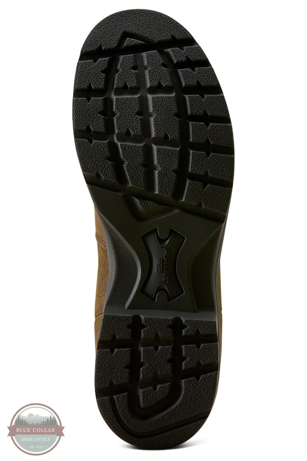 Ariat 10080326 Cooper Chelsea Boot in Distressed Tan. A close-up view of the treaded outsole of a brown boot on a white background, with a circular Blue Collar Wholesale logo watermark in the bottom-left corner.