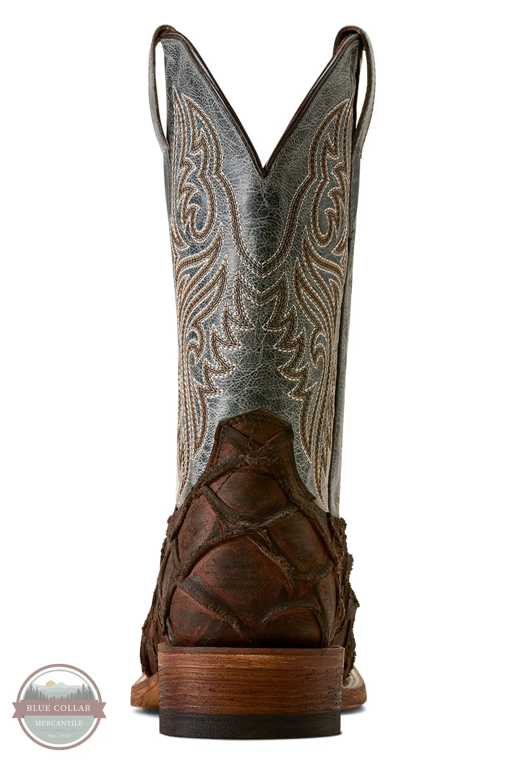 Ariat's 10080345 Men's Riverside Exotics Print Square Toe Western Boot in Chocolate Bass Print / Indigo Honor Blue, A single cowboy boot shown from the back on a white background, featuring a distressed gray leather shaft with tan western embroidery, a dark brown textured heel, and a stacked wood-toned heel block.