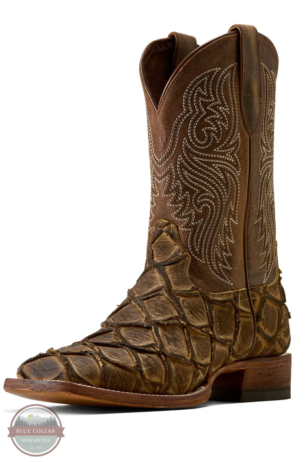 Ariat's 10080347 Men's Riverside Square Toe Cowboy Boot | Exotic Print in Tan Bass/Loco Brown, A brown western cowboy boot with a crocodile-embossed pattern on the foot and shaft, featuring white embroidered stitching on the shaft, shown against a white background.