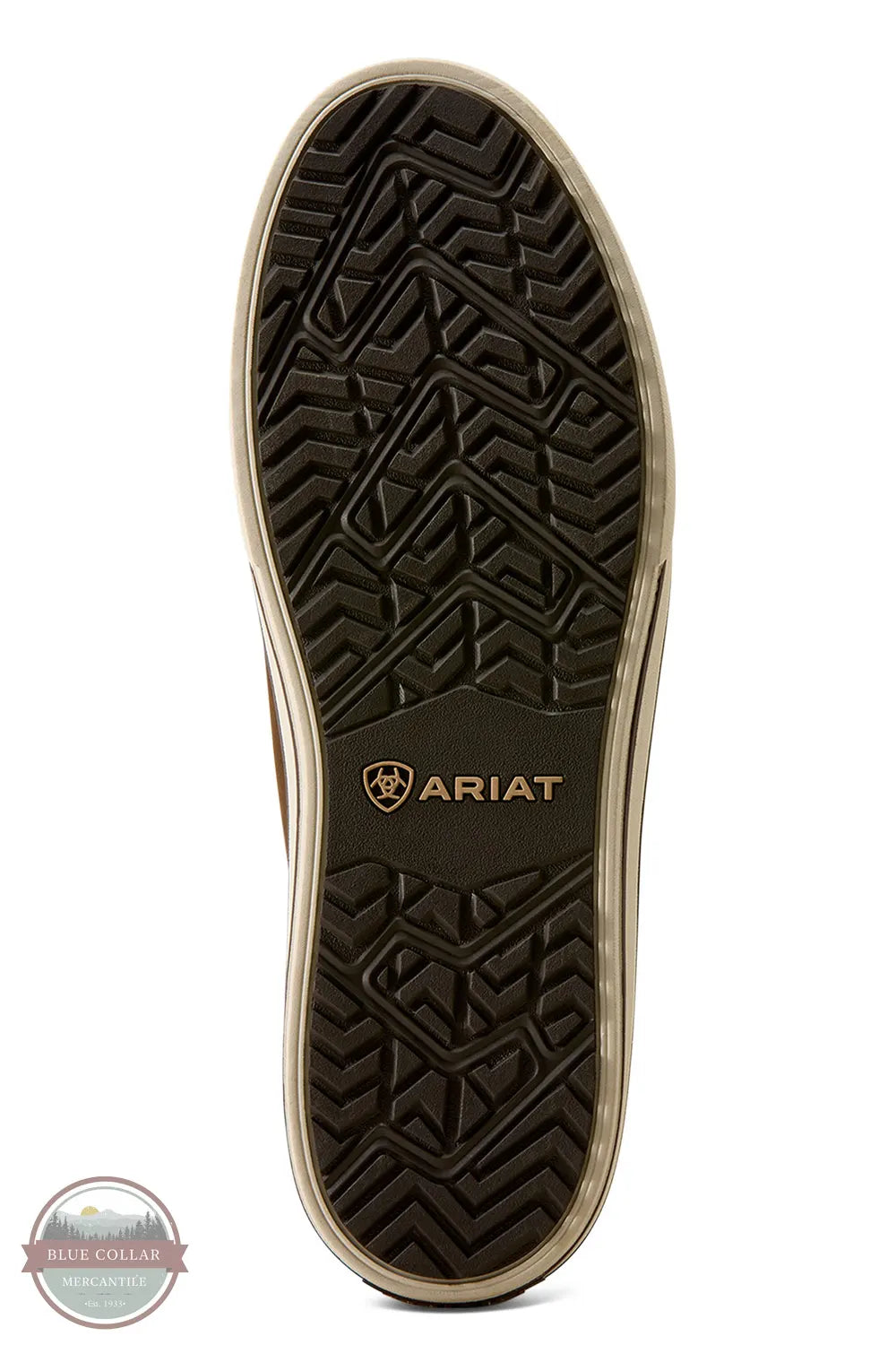 Ariat Saylor Shrimp Waterproof Boot in Dark Brown / Camo. The treaded outsole of a brown and beige shoe, featuring the Ariat logo in gold near the heel, shown against a plain white background.