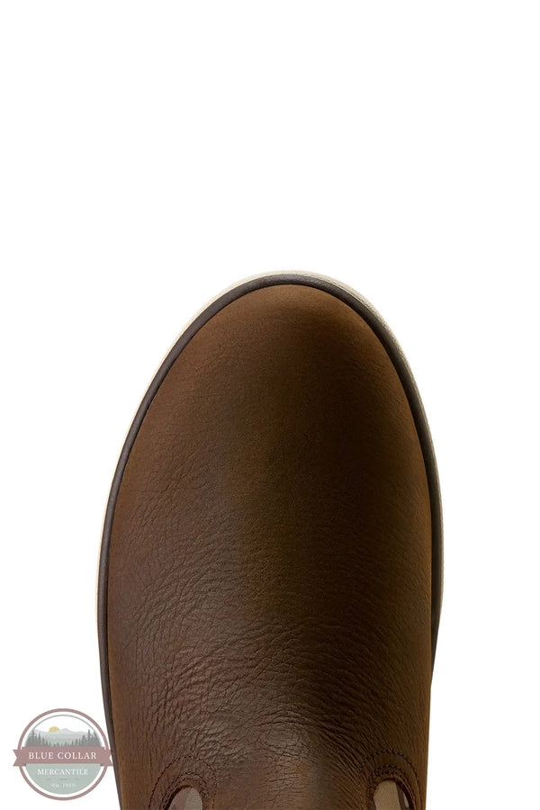 Ariat Saylor Shrimp Waterproof Boot in Dark Brown / Camo. Close-up top-down view of a brown leather boot on a white background, showing the toe and side profile with a small Blue Collar logo watermark in the lower-left corner.