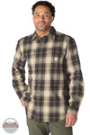 Carhartt 107013-N04 Men's Hubbard Loose Fit Long Sleeve Flannel Plaid Shirt, A man wearing a Carhartt long-sleeve plaid button-down shirt in brown, beige, and black tones, paired with olive green pants, against a plain white background.