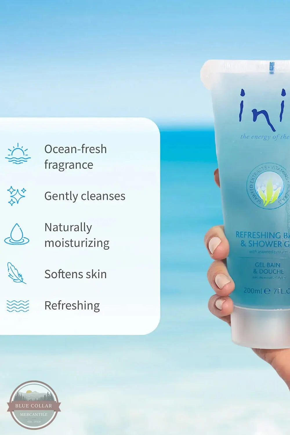 Inis 8005090 Refreshing Bath & Shower Gel 7FL OZ. A hand holds a tube of ini Refreshing Body & Shower Gel against a tropical beach background. A white text box on the left lists product benefits including ocean-fresh fragrance, gentle cleansing, moisturizing, softening skin, and refreshing.