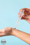 Inis 8017130 Roll On Eau De Parfum .27FL OZ. being applied on the wrist