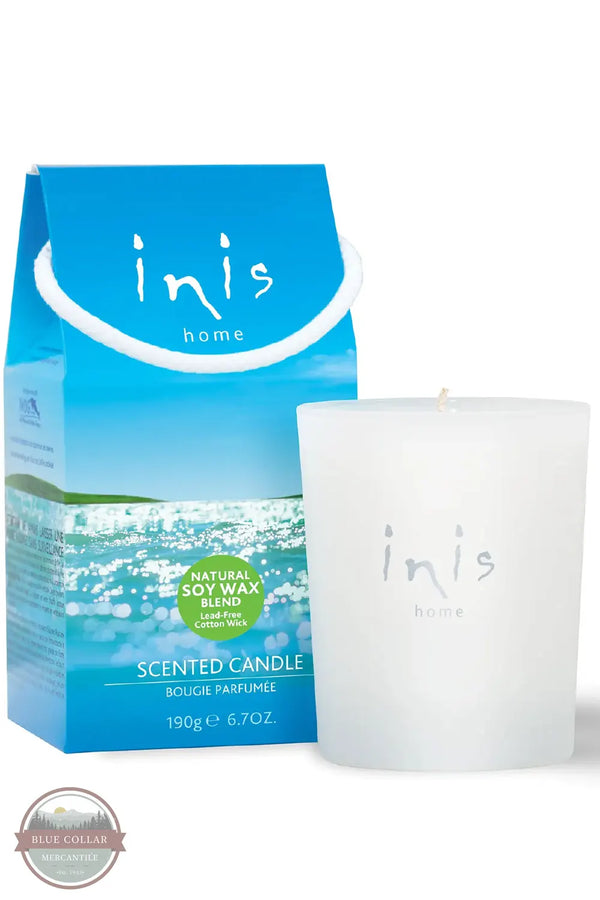 Inis 8017185 Scented Candle 6.7 oz., An Inis Home scented candle in a frosted white glass jar next to its blue packaging box, featuring a blue sky and ocean design with a green 'Natural Soy Wax' badge.