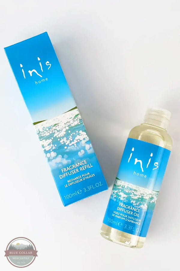 Inis 8017246 Fragrance Diffuser Refill 3.3 fl. oz., A bottle and box of inis home Fragrance Diffuser Refill on a white background, featuring a blue and white ocean-themed label.