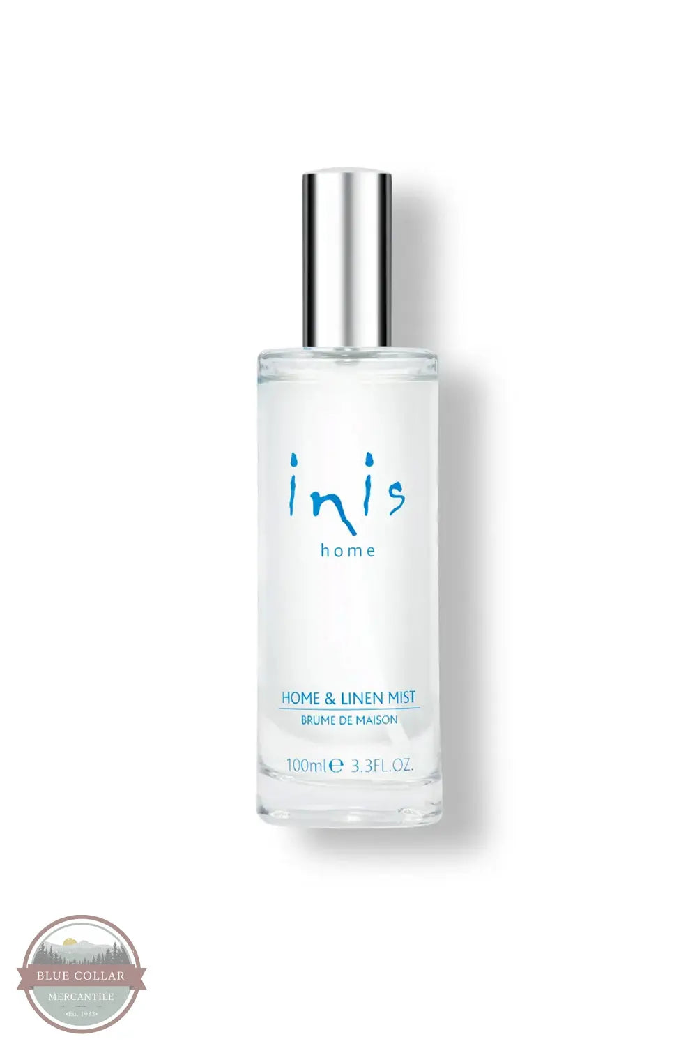 Inis 8020901 Home & Linen Mist 3.3fl. oz., A 700ml clear glass bottle of Inis Home & Linen Mist with a silver cylindrical cap, featuring blue branding text on a white background.