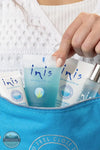 Inis 8021236 Voyager Gift Set | Traveler Size woman pulling out products from travel pouch