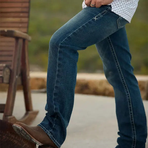 Mens Jeans from Ariat, Carhartt, Levi's, Wrangler and more! available at Blue Collar Mercantile The Workingman's Store man wearing Ariat jeans outside shown