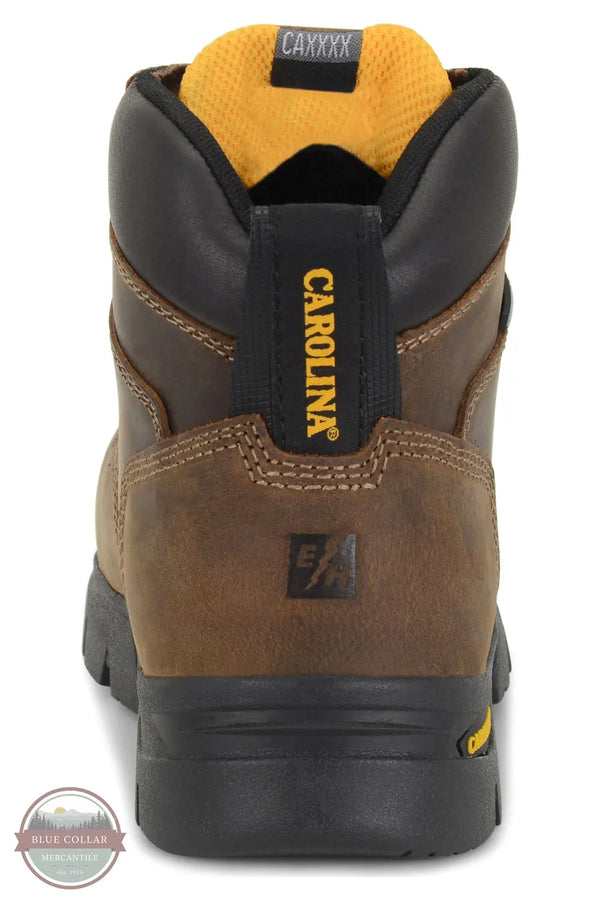 Carolina CIRCUIT CA1626 Women's 6" Waterproof Composite Toe Work Boot, A close-up rear view of a brown and black Carolina work boot with a yellow interior lining and yellow branding on the heel pull tab.