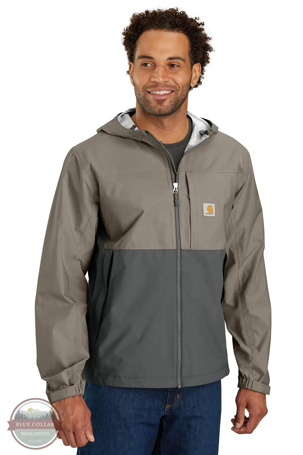 Carhartt 105751 Storm Defender Relaxed Fit Lightweight Packable Jacket in tan/gray, model front view