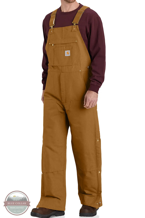 Carhartt 106672 Loose Fit Firm Duck Insulated Bib Overall - 2 Warmer Rating in Carhartt Brown on model