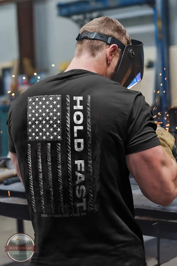 Kerusso KHF5045 Hold Fast Men's Rebar Flag T-Shirt in Black lifestyle image of a welder wearing the shirt