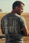 Kerusso KHF5213 Hold Fast Men's Duty &amp; Honor T-Shirt in Grey lifestyle image of man leaning on fence wearing this shirt