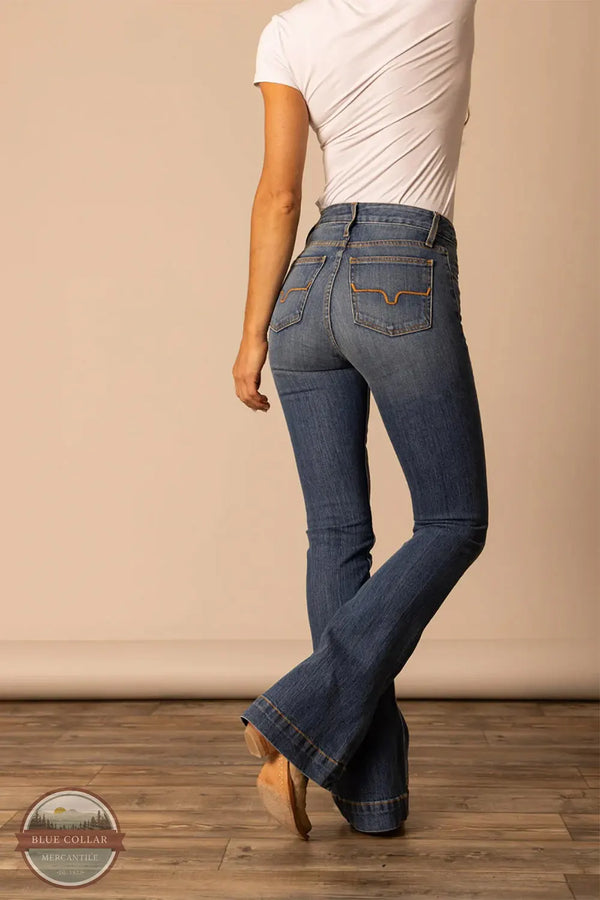 Person wearing blue jeans and a white top on a beige background Kimes Ranch WJE0000008 Jennifer Jeans Mid Wash rear view