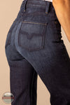 Dark blue jeans with a visible brand logo on a beige background Kimes Ranch WJE0000016 Olivia dark wash