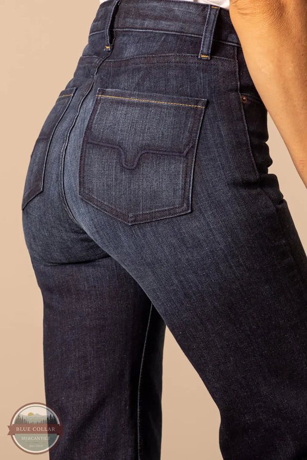 Dark blue jeans with a visible brand logo on a beige background Kimes Ranch WJE0000016 Olivia dark wash