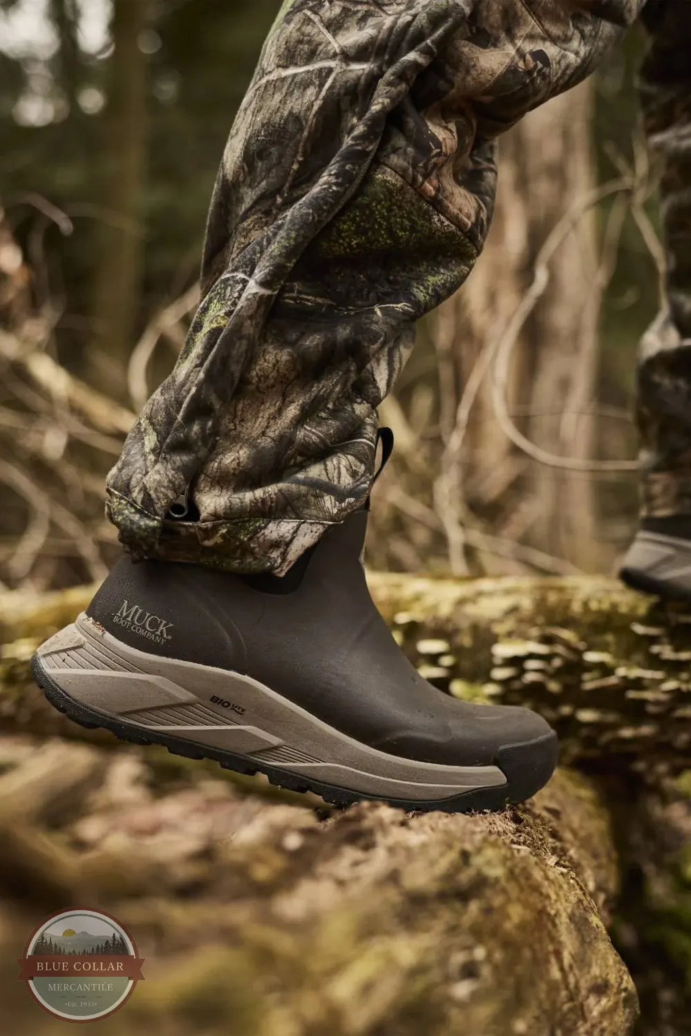 Muck Outmax Men's Outdoor Ankle Boot in Turkish Coffee Brown MOX6M90 lifestylel image of boot being worn in the woods