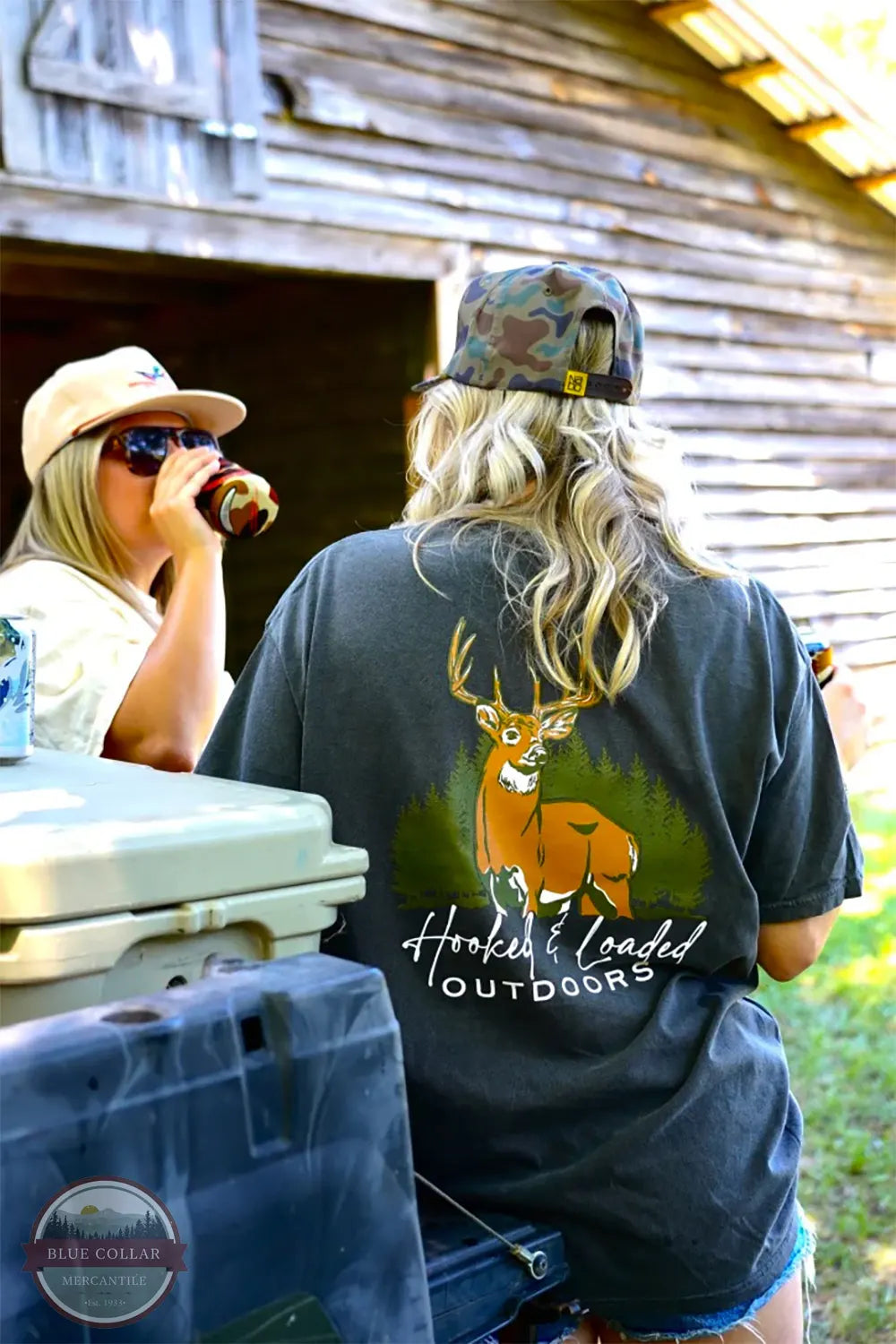 Big Buck Hunter in Pepper Grey - Short Sleeve Pocket T-Shirt by Hooked & Loaded Outdoors, LLC lifestyle image of girls sitting on truck bed in t-shirt