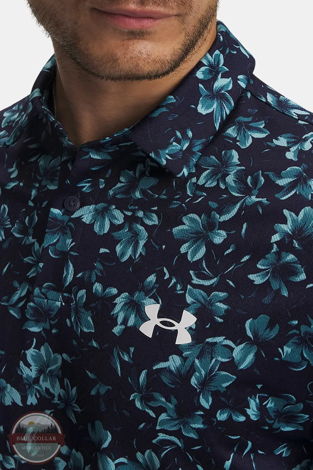 Under Armour 6009800-411 UA Matchplay Printed Men's Polo in Midnight Navy / Blue Haze / White close up view of front logo