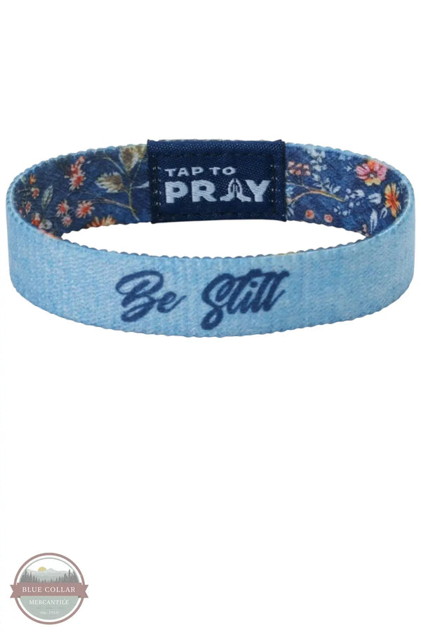 Versible's Wildflower-Be Still Tap To Pray Wristband Be Still Logo Shown