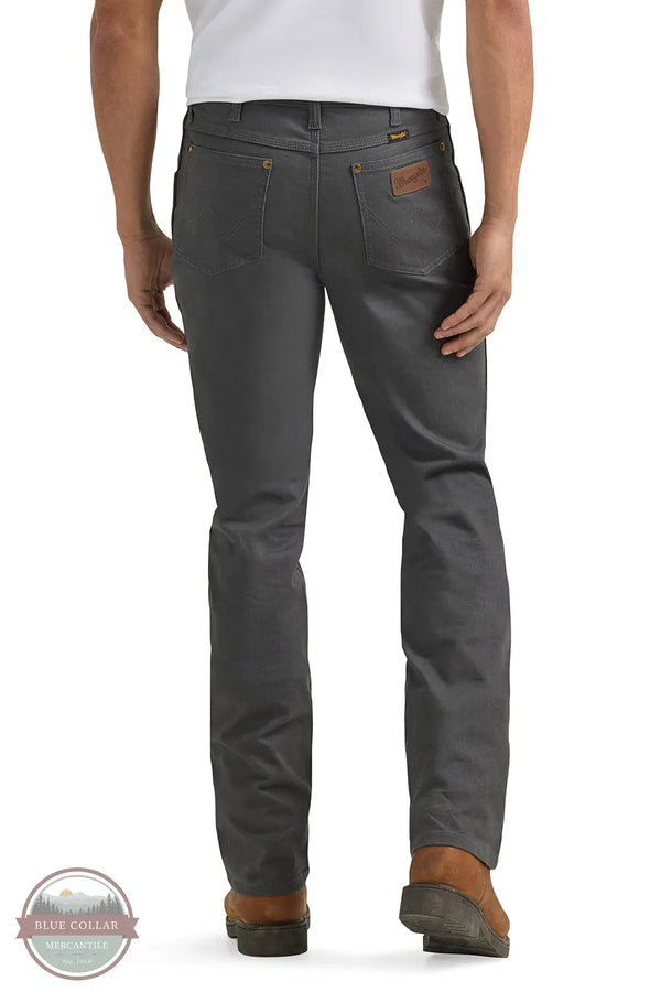 Person wearing gray pants with a visible brand logo on a white background Wrangler 112361474 Premium Performance Tough Comfort Cowboy Cut Slim Fit Canvas Jean in Grey Pinstripe rear view
