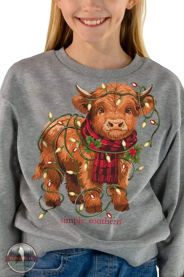 Simply Southern Girls' Highland Cow Light Crewneck Sweatshirt in Heather Gray YTH-SWT-LIGHTS-HTHRGRY on model